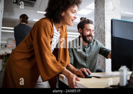 Software engineers working on project and programming in company Stock Photo