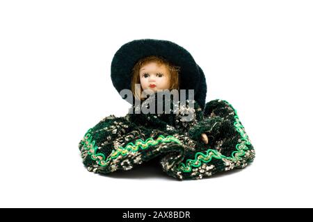 Porcelain doll in a green dress Stock Photo