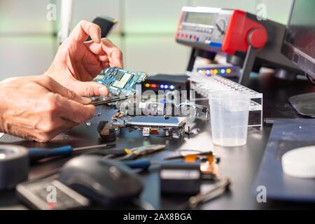 Support Repair Photo Technology repair of photo camera in services support Stock Photo - Alamy