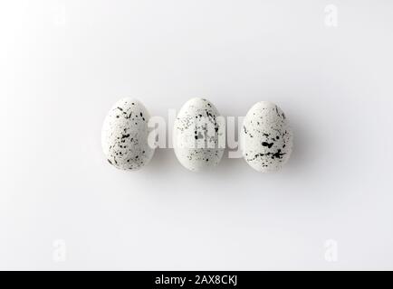 Creative Easter layout made of painted eggs on white background Stock Photo
