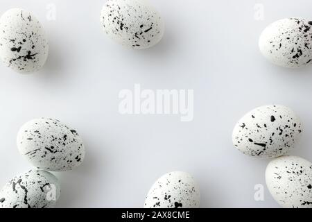 Creative Easter layout made of painted eggs on white background Stock Photo