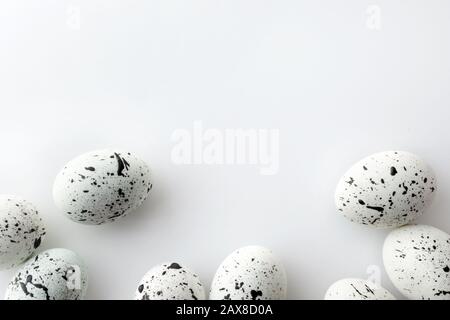 Creative Easter layout made of painted eggs on white background Stock Photo