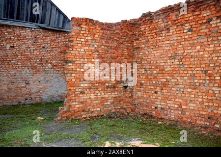 Old ruined red brick wall, abandoned building Stock Photo