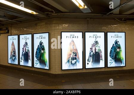 A Flushing line subway train in Times Square is wrapped in