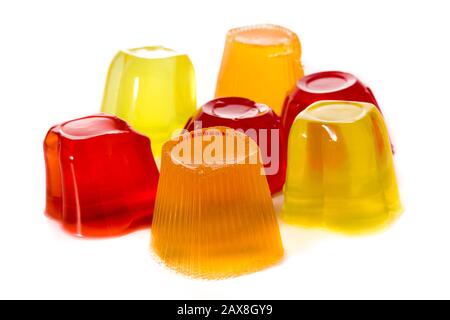Jellies of different flavors in a plastic cups isolated on white background Stock Photo
