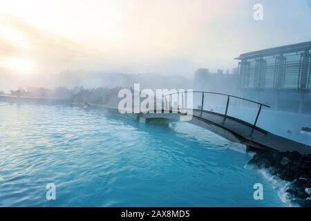 Blue Lagoon next to Reykjavik with people bathing in this natural hot spring . Stock Photo