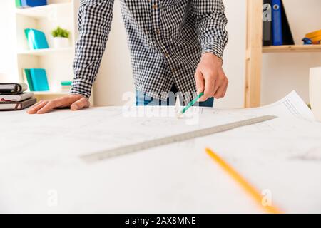 Close up of young engineer drawing scheme for his project Stock Photo