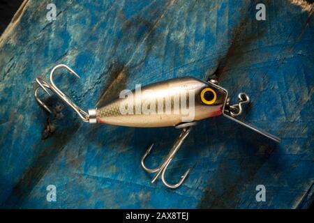 https://l450v.alamy.com/450v/2ax8tej/an-old-fishing-lure-or-plug-equipped-with-treble-hooks-designed-to-catch-predatory-fish-the-lure-has-possibly-been-made-by-woods-mfg-but-this-cann-2ax8tej.jpg