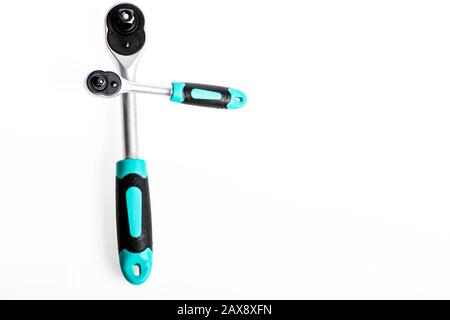Ratchet tool. Steel made with no skid threaded handle you can hold firmly without slipping. Socket spanner wrenches white background. Knob for socket wrench nut ratchet close up. Ratchet wrench. Stock Photo