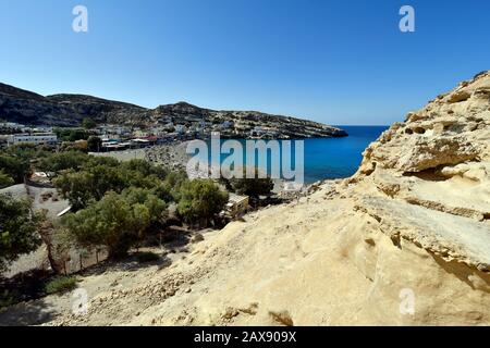 Greece, Crete Island, beach from Matala on coast of Libyan sea and ancient tombs, preferred travel and vacation destination Stock Photo