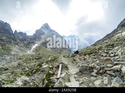 Clouds moving over the High Tatras Mountains near Chata pod Rysmi, the highest mountain chalet in High Tatras and Slovakia (2250m above sea level) Stock Photo