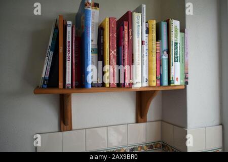 Cookbooks on  an English  kitchen shelf Stock Photo