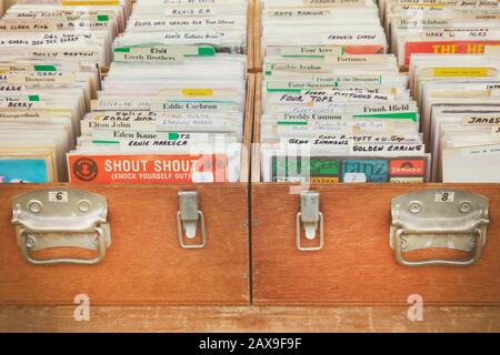 Den Bosch, The Netherlands - May 12, 2019: Wooden boxes with vinyl turntable records on an antique fifties to seventies flea market in Den Bosch, The Stock Photo