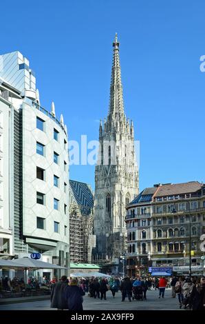 Vienna, Austria - March 27th 2016: Unidentified crowd of people on Stephansplatz with Haas Haus and Stephansdom cathedral in the center of the city Stock Photo