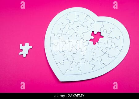Incomplete heart puzzle with missing piece isolated on white background ...