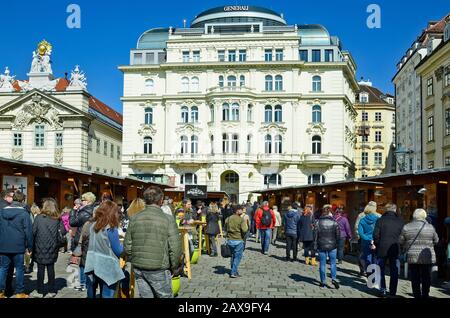 Vienna, Austria - March 27th 2016: Unidentified people by traditional Easter market on Am Hof square with different buildings Stock Photo