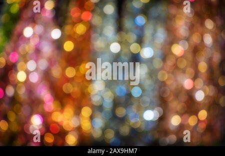 Colorful bokeh from out of focus of festival glitters design lighting. Stock Photo