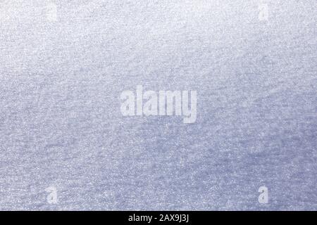 White snow texture. Empty background with smooth snow surface. Stock Photo