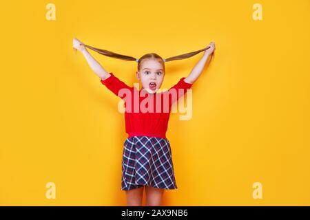 Little girl sticking tongue out happy with funny expression. Emotion concept. Stock Photo