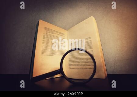 Magnifying glass with old sheets isolated on white background Stock ...