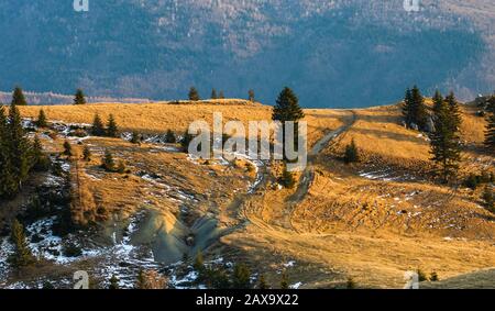 Beautiful lanscape of snowy mountains. Beautiful winter nature landscape amazing mountain view. mountain range and pine tree forest with thin snow.