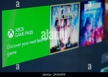 New-York , USA - February  11, 2020: Xbox game pass subscription  for gaming online on tv screen close up Stock Photo