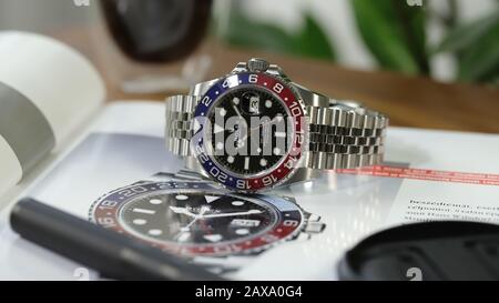 Rolex GMT Master II aka the Pepsi Luxury watch on a watch magazine. Stock Photo