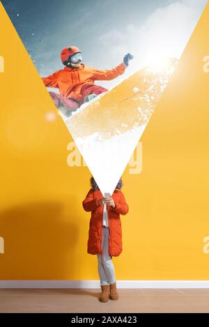 Young caucasian woman with smartphone, serfing, opening world with her gadget isolated on yellow background. Concept of modern technologies, millennials, social media, dreaming. Stock Photo