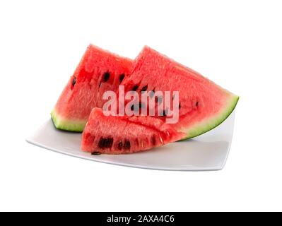 Watermelon slices on a plate in summer time. Slice of watermelon isolated on white background. Stock Photo