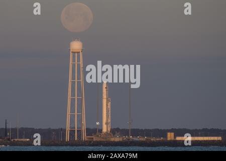 A Northrop Grumman Antares rocket carrying a Cygnus resupply spacecraft is seen at sunrise as the Moon sets on Pad-0A, on February 9, 2020, at NASA's Wallops Flight Facility in Virginia. Northrop Grumman's 13th contracted cargo resupply mission with NASA to the International Space Station will deliver about 7,500 pounds of science and research, crew supplies, and vehicle hardware to the orbital laboratory and its crew. The CRS-13 Cygnus spacecraft is named after the first African American astronaut, Major Robert Henry Lawrence Jr. NASA Photo by Aubrey Gemignani/UPI