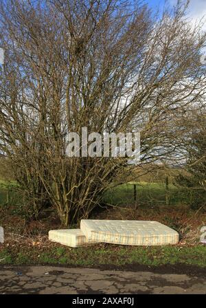 Mattresses fly-tipped in the countryside, UK. Stock Photo