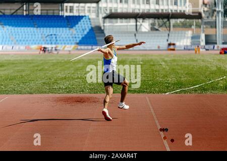 javelin throw back athlete thrower in track and field event Stock Photo