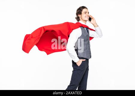 Young man superhero talk on the phone on white background Stock Photo