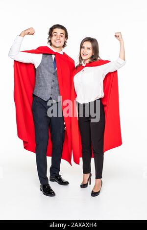 super couple in masks and cloaks standing with crossed arms and looking at camera isolated on grey Stock Photo
