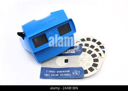 Vintage plastic stereoscopic slide viewer with picture reels, front view, isolated on white background, close-up Stock Photo
