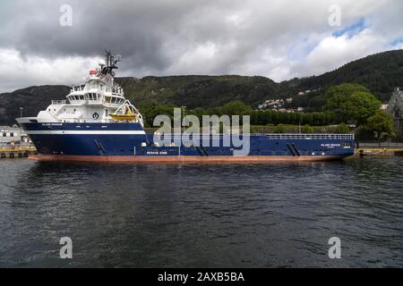 Offshore PSV fire fighting, stand-by vessel Island Dragon in the port of Bergen, Norway. Stock Photo