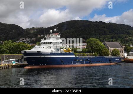 Offshore PSV fire fighting, stand-by vessel Island Dragon in the port of Bergen, Norway. Stock Photo