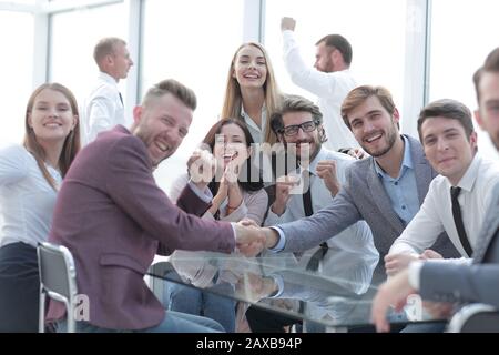 happy business people shaking hands in the conference room Stock Photo