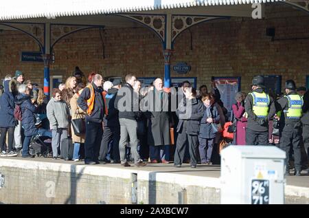 Passengers are held back as they wait for Queen Elizabeth II to board a train at King's Lynn railway station in Norfolk, as she returns to London after spending the Christmas period at Sandringham House in north Norfolk. PA Photo. Picture date: Tuesday February 11, 2020. Photo credit should read: Nick Ansell/PA Wire Stock Photo