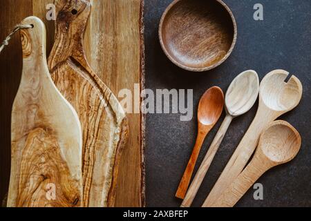 Top view of rustic wooden kitchenware. Cutting boards and spoons. Eco and natural cooking concept. Stock Photo