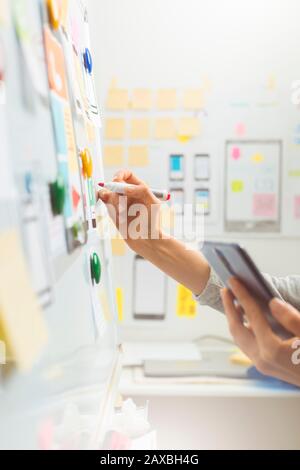 UI website designers are developing a mobile phone application interface. User experience Stock Photo