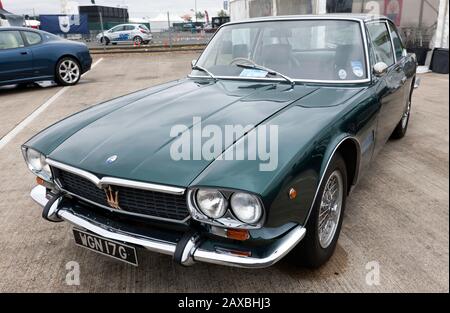 Three-quarters front view of a Green, 1968, Maserati Mexico, on display in the  Maserati Club UK zone of the 2019 Silverstone Classic Stock Photo