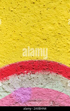 Abstract stucco texture of different color colors - yellow, red, white, pink. Close up. Stock Photo