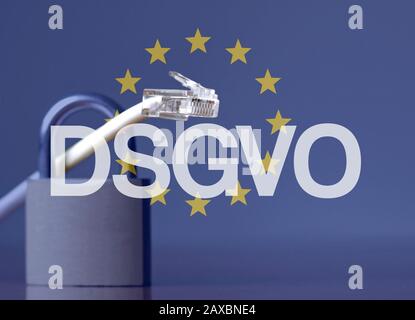 DSGVO acronym against the EU flag and a padlock and ethernet cable Stock Photo