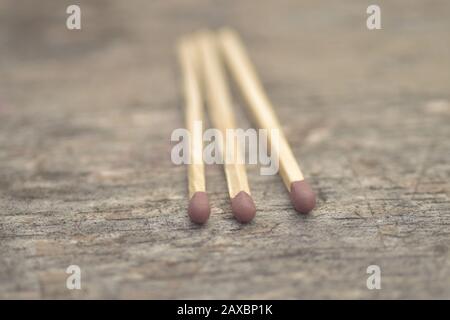 Selective focus closeup shot of three match sticks on a surface Stock Photo