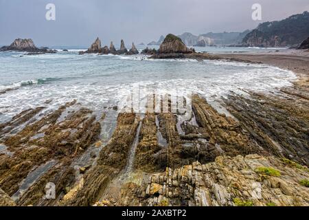 Tranquil rocky ocean beach Gueira Beach Asturias Spain Stock Photo