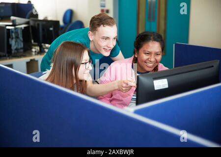 College students using computer in classroom Stock Photo