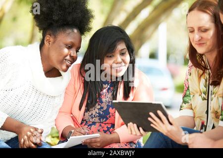 Young female college students studying with digital tablet Stock Photo