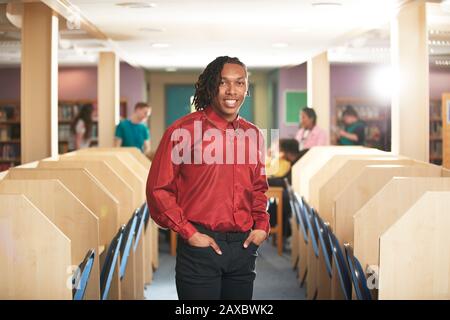 Portrait confident young male college student in computer lab Stock Photo