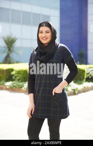 Portrait confident young woman in hijab Stock Photo